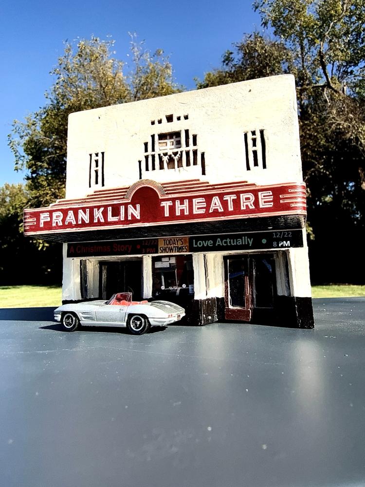 HO-scale Franklin Theatre miniature, front view showing marquee and silver convertible