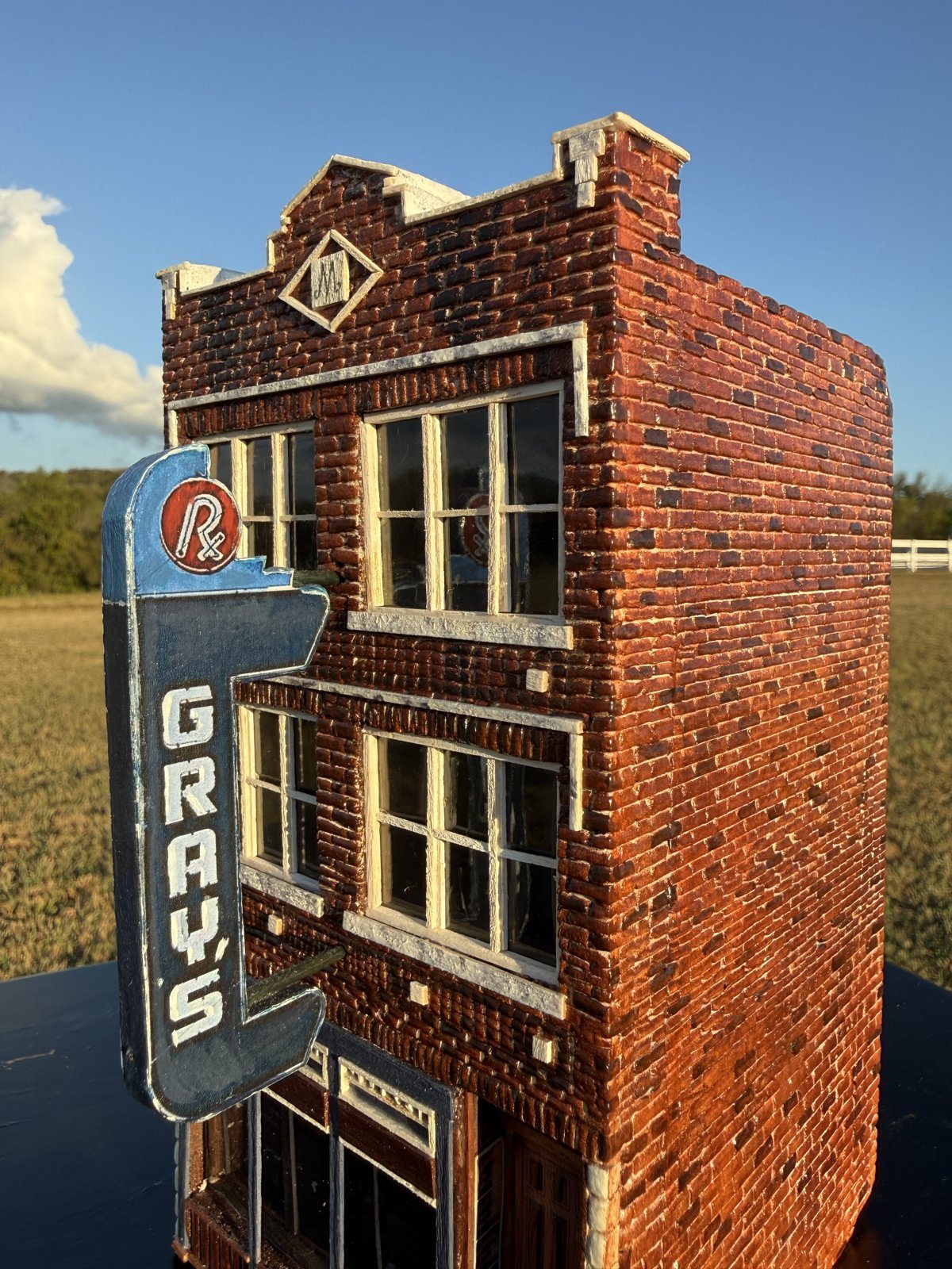 Gray's on Main miniature, right-front view, with the hand-painted Rx neon sign