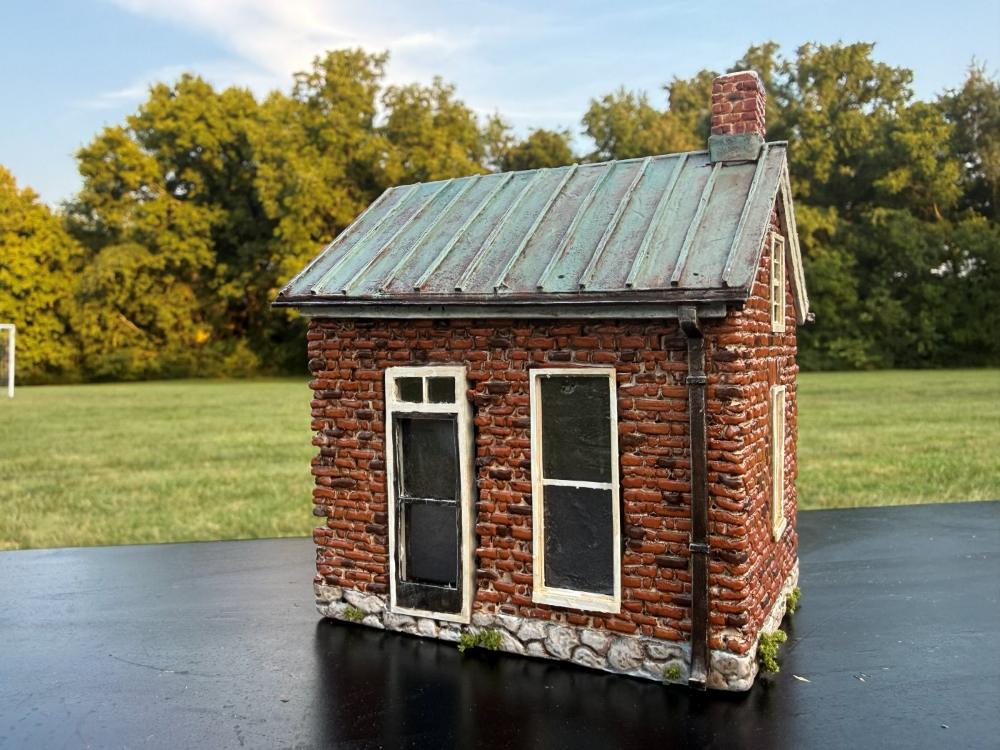 McPhail House miniature, side view showing the windows and stone foundation